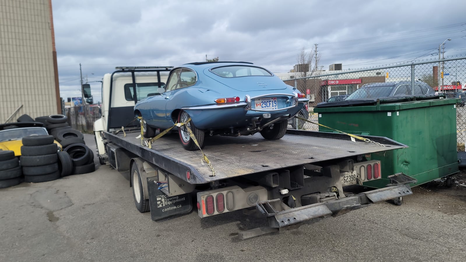 old car being towed in toronto